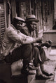 Poster print of two African American men sitting on a stoop in Charleston, South Carolina.