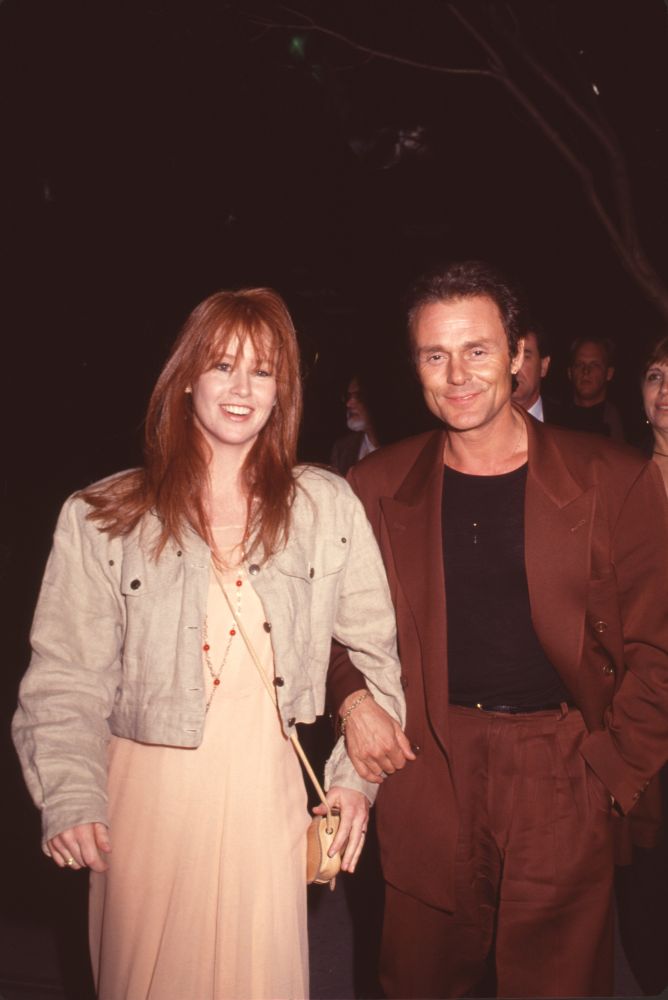 Tracy Griffith in tan outfit and Michael Des Barres in brown suit photo print.