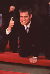 Jim Carrey Making a Face Before Signing Hand & Foot Prints Photo Print