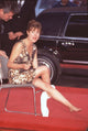 Susan Sarandon sitting on chair wiping her feet at Hands & Feet ceremony photo print.