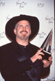 Garth Brooks holding award at 24th American Music Awards photo print.