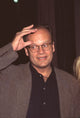 Kelsey Grammer photo print capturing a candid moment while scratching his forehead.