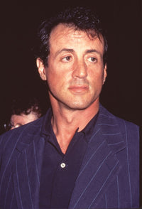 Sylvester Stallone in a striped suit and navy shirt photo print