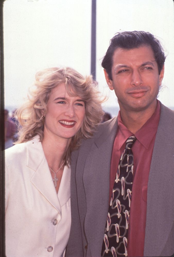 Laura Dern in white blazer with Jeff Goldblum in gray suit and red shirt photo print.
