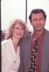 Laura Dern in white blazer with Jeff Goldblum in gray suit and red shirt photo print.