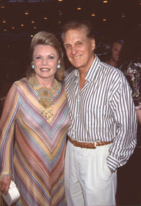 Robert Stack and Rosemarie photo print in colorful striped outfits.