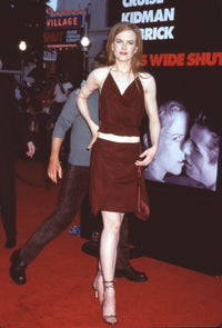 Nicole Kidman photo print at the 'Eyes Wide Shut' movie premiere in a brown top and skirt.