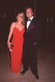 Photo print of Doug Davidson in tuxedo with wife Cindy in red dress.