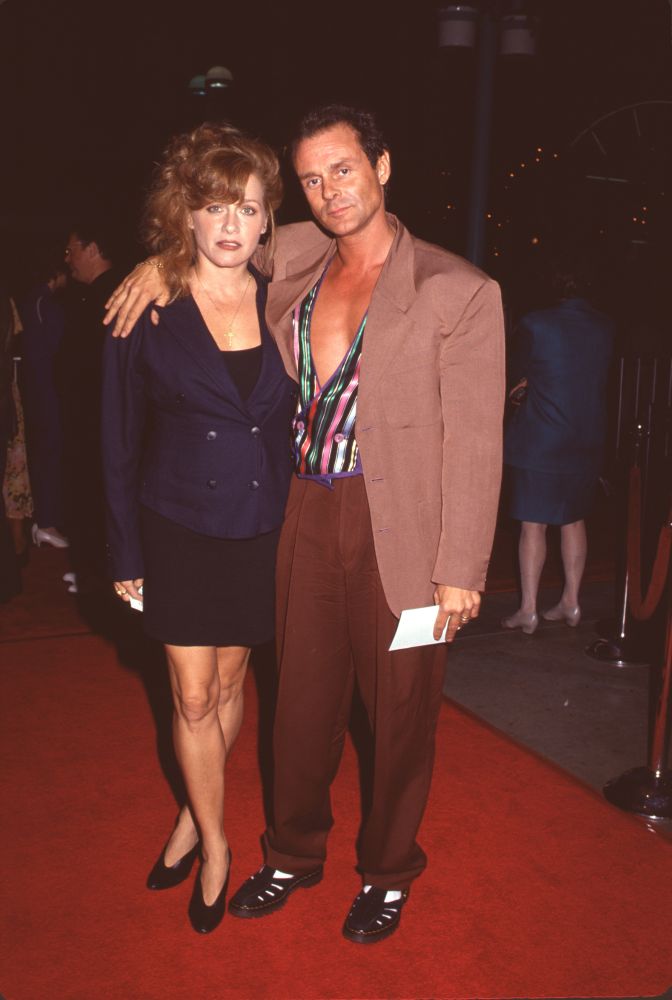 Patti D'Arbanville in skirt suit with Michael Des Barres in brown jacket photo print.