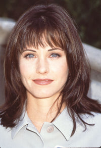 Close-up photo print of Courtney Cox wearing a tan jacket