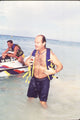 Kelsey Grammer Removing Life Vest Photo Print in various sizes.