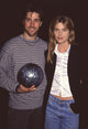 Matthew Fox holding a bowling ball with Paula Devico in white silk shirt photo print.