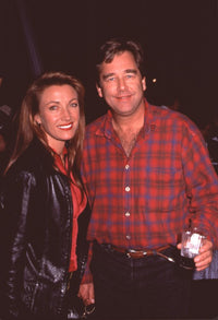 Jane Seymour in red top and leather jacket with Beau Bridges in plaid shirt at 101 Dalmatians party photo print