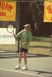 Cynthia Geary Playing Tennis Photo Print showcasing action and energy.