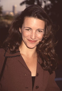 Kristin Davis smiling in a brown jacket photo print.
