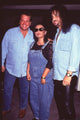 Photo print of Tom Arnold and Roseanne Arnold with Gene Simmons at his birthday party.