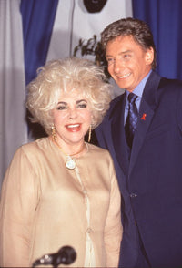 Elizabeth Taylor and Barry Manilow laughing photo print