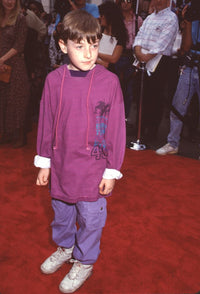 Adam Hann-Byrd at the 'Little Man' premiere wearing purple pants and a striped hoodie - Photo Print