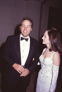 Brandon Tartikoff in tuxedo with wife Lilly in white gown photo print.
