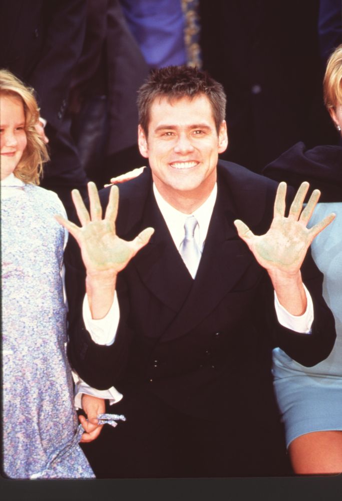 Jim Carrey photo print with cement on hands, vibrant and fun decor.