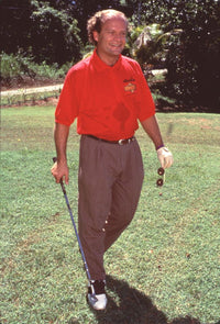 Kelsey Grammer golfing in a red polo and brown pants photo print