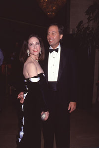 Brandon Tartikoff in tuxedo with wife Lily Tartikoff in elegant black gown photo print
