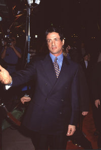 Sylvester Stallone in navy suit at Titanic premiere photo print.