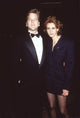 Kiefer Sutherland in tuxedo with Julia Roberts in striped skirt suit photo print.