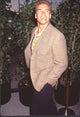 Arnold Schwarzenegger photo print from 'True Lies' premiere with hands in pockets.