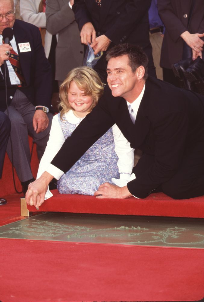 Jane and Jim Carrey smiling over cement photo print.