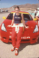 Melissa Joan Hart leaning on a Toyota during a celebrity race photo print.