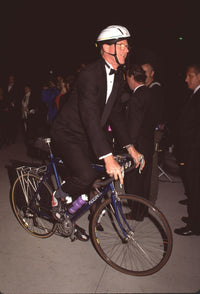 Ed Begley Jr. riding bike in tuxedo at Vanity Fair Oscar Party photo print.