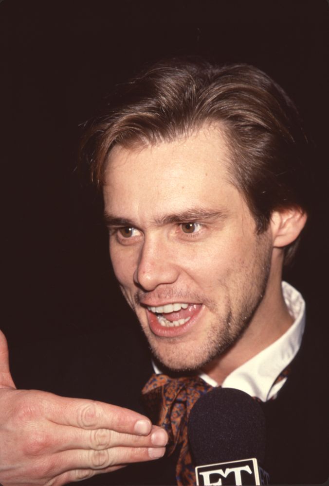 Jim Carrey being interviewed at the Dumb and Dumber premiere photo print.