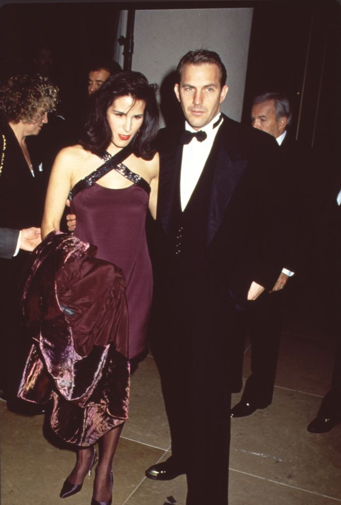 Kevin Costner in tuxedo with Cindy Costner in purple dress photo print.