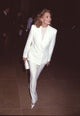 Faye Dunaway elegant photo print in white pant suit and clutch.