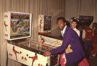 Clifton Davis Playing Pinball Photo Print showcasing a fun moment.