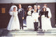 Tom and Roseanne Arnold wedding party photo print featuring joyful celebration on steps.