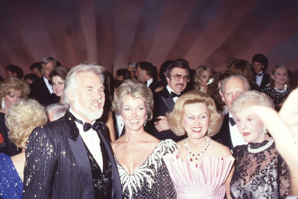 Kenny Rogers photo print featuring Jane Seymour, Barbara Davis, and Mary Martin.