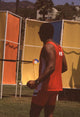 Clifton Davis photo print in red shorts and tank top