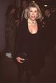 Joan Rivers elegant photo print in black skirt suit with pearl choker