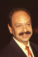 Cheech Marin closeup photo print in suit with orange tie.