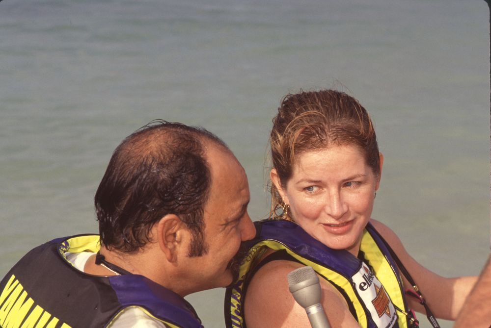 Cheech Marin and Patti looking at each other in life jackets photo print