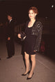 Melanie Mayron photo print in black dress with jeweled jacket.