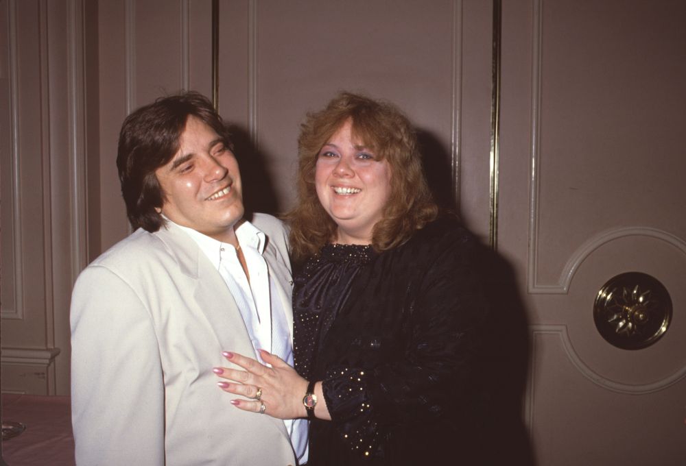 Jose Feliciano in cream suit with wife Susa in black and gold outfit photo print
