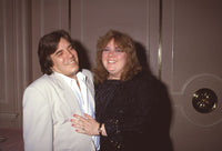 Jose Feliciano in cream suit with wife Susa in black and gold outfit photo print