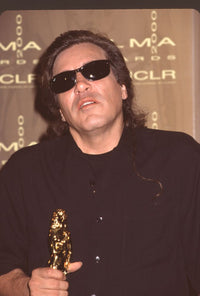 Jose Feliciano holding award at the 2000 Alma Awards photo print.