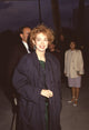 Melanie Mayron wearing a black trench coat photo print