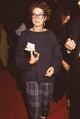 Melanie Mayron in sweatshirt and gray plaid pants photo print