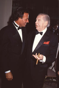 Julio Iglesias talking to Milton Berle with cigar photo print.