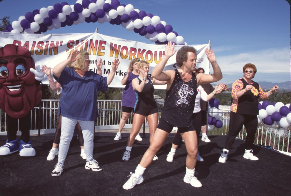 Richard Simmons exercising on stage during his Raisin Shine Workout photo print.